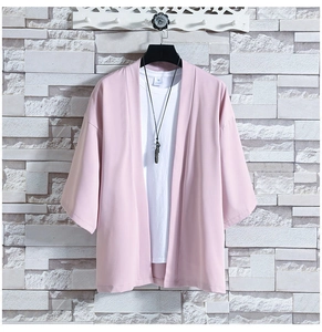 Close-up of pink ice silk kimono cardigan showing dropped shoulder seam and smooth texture