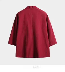 Detail of dark red linen texture and dropped shoulder seam on a Japanese kimono jacket