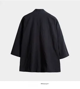 Detailed macro view of black linen fabric texture on Chinese style kimono cardigan