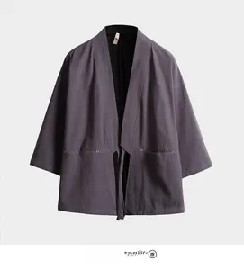 Detail of dark grey kimono cardigan with seven-point sleeves and large patch pockets