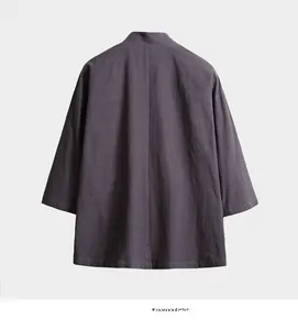 Close-up of textured cotton linen fabric on a loose Chinese style open cardigan