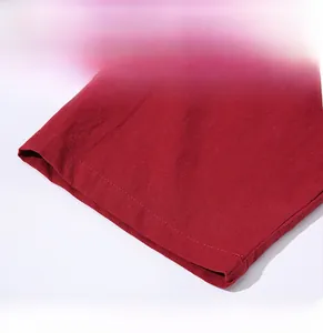 Detail view of red cotton linen jacket sleeve with precise double-row stitching