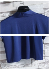 Detail view of the standing collar and smooth hem stitching on blue ice silk cardigan