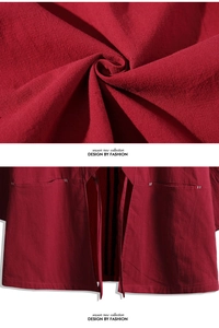 Detail of red cotton linen cardigan showing fabric texture, large pocket and tie closure
