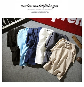 Detail shot of men's linen Henley shirt showing six colors and breathable fabric texture