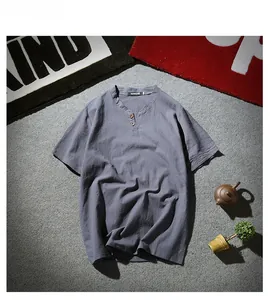 Detail of grey-blue linen Henley shirt collar with wooden buttons and textured fabric