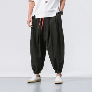 Men's black cotton linen harem pants with elastic waist and red contrast drawstring