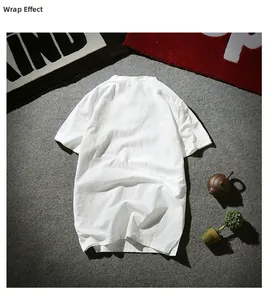 Back view of a white linen cotton short-sleeved shirt on a grey textured background