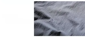 Close-up of high-quality dark grey cotton-linen fabric with breathable woven texture