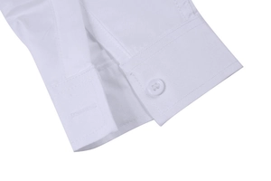 Close-up detail of a white dress shirt cuff showing neat stitching and button
