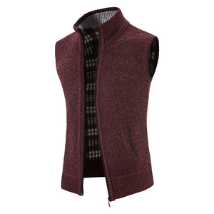 Detail of burgundy knit cardigan vest showing metal zipper, high collar and plaid lining