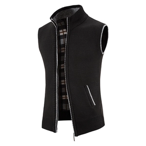 Detail of men's knitted vest showing contrast gray trim and soft fleece check lining