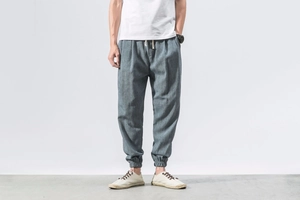 Close-up of drawstring waist and linen fabric texture on men's jogger pants