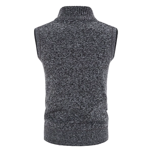 Macro shot of men's knitted vest showing grey melange texture and ribbed hem detail
