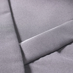 Macro detail of gray twill fabric texture for men's tailored suits and formal wear