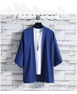 Detail view of navy blue ice silk sun protection kimono with black feather necklace
