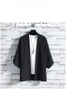 Detail of loose black kimono sun protection jacket with breathable ice silk fabric