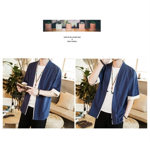 Detail of navy blue Japanese style kimono cardigan with beige contrast trim and texture