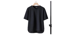 Detail view of oversized black T-shirt showing curved hem and high-density cotton texture