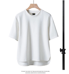 Detail of high-quality pique fabric white T-shirt with CORDURA label and split curved hem