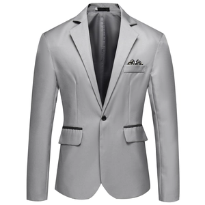 Detail of light grey slim fit suit jacket with floral pocket square and black piped pockets