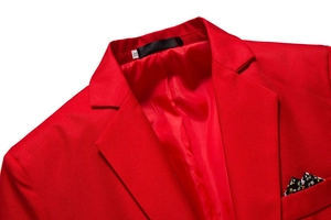 Detail of red slim fit blazer showing lapel texture, floral pocket square, and XL tag