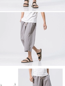 Detail view of grey linen harem pants with adjustable drawstring and elastic waistband