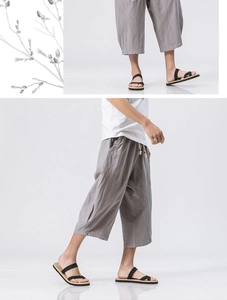 Detail of linen cropped pants with elastic drawstring waist and side pockets in grey-purple