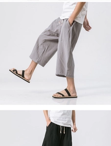 Detailed view of linen blend cropped pants with elastic drawstring waist and side pockets