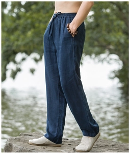 Detail of navy blue linen blend pants showing elastic waist with adjustable drawstring