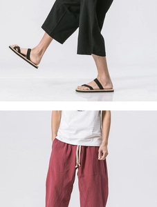 Detail showing loose fit linen pants with elastic drawstring waist and premium fabric texture