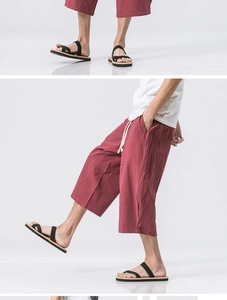 Detail of reddish-brown linen cropped pants with drawstring elastic waist and side pockets