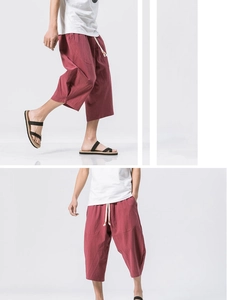 Detail of dark pink linen cropped pants showing drawstring waist and natural texture