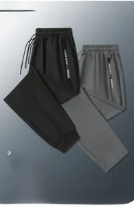 Detail of high-stretch ice silk pants featuring a side zipper pocket and drawstring waist