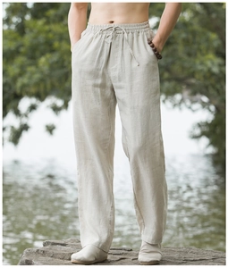 Close-up of linen blend trousers showing breathable texture and elastic drawstring waist