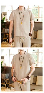 Detail view of men's beige cotton linen short sleeve shirt and casual trousers set
