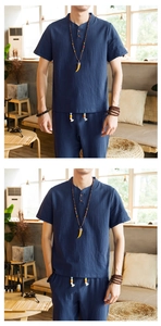 Detail of navy cotton linen men set featuring a V-neck shirt with button and beaded drawstring