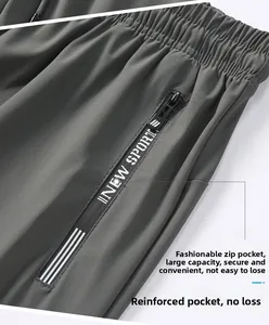 Detail view of ice silk pants featuring a secure zipper pocket and elastic waistband
