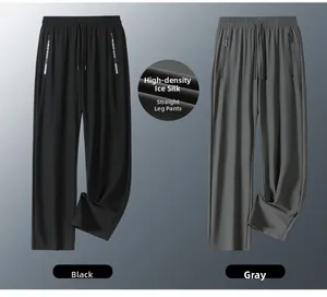 Detail of ice silk fabric on black and grey straight leg trousers with zip pockets