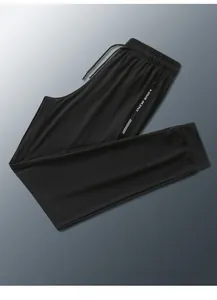Detail of men's ice silk joggers showing elastic waistband and zip pocket with New Sport logo
