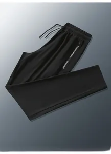 Detail of men's black ice silk sports pants with elastic drawstring waist and zipper pocket