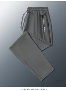 Detail of grey ice silk sport trousers with elastic drawstring waist and zipper pocket