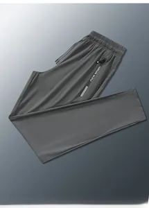 Detail of dark gray ice silk sports pants featuring elastic waist and zipper pocket