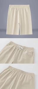 Detail view of men's beige cotton linen shorts featuring elastic waist and white drawstring