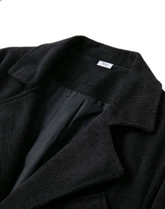 Detail view of black corduroy blazer with notched lapel and size 5XL inner label