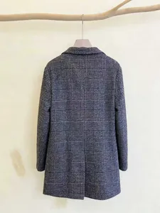 Detailed rear view of plaid woolen coat featuring clean straight cut lines and thick texture