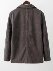 Back detail of men's dark brown corduroy blazer with vertical ribbed texture and drape