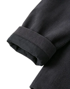 Detail view of charcoal grey corduroy fabric texture and sleeve cuff with smooth black lining