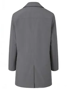 Detail of dark grey trench coat back with horizontal seam and central vent slit