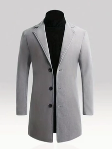 Close-up of light grey wool overcoat featuring classic lapels and single-breasted buttons